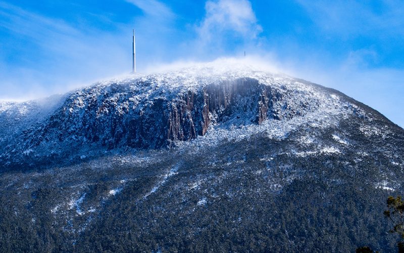 A cold mount wellington in Hobart Tasmania with snow on it suggesting its time to heat your house.
